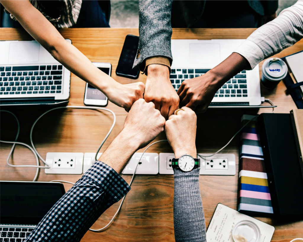 Fists unite - Group fist bump